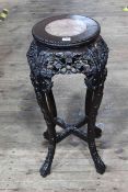 Oriental circular carved hardwood and marble inset top jardiniere stand, 68cm by 28cm diameter.