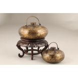 Two 19th/20th century Chinese hot water flasks, bronzed finish with gilt decoration, screw lids