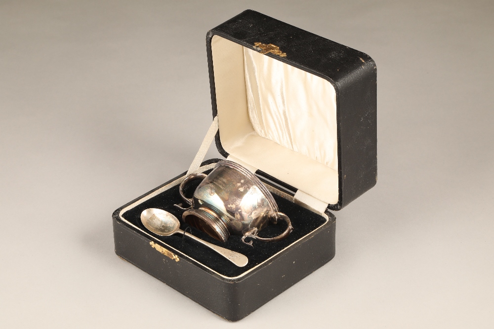 Boxed silver christening set, double handled bowl and a spoon, assay marked Chester 1931. Total