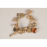 Ladies 9 carat gold charm bracelet, with heart shaped clasp. 17 charms. Total weight 59g