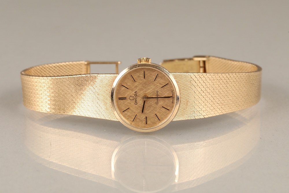 Ladies 9ct carat gold Omega wrist watch, gilt dial with gilt baton hour