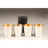 Set of four silver beakers with gilt interiors and leather case, Birmingham 1981. Maker P.H