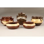 Five assorted pieces of Cumnock pottery, four bowls with twig form handles, red brown with cream