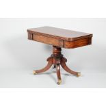 19th century mahogany foldover tea table, raised on a turned pedestal and a quadrafom base with four