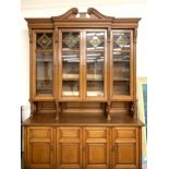 Edwardian oak bookcase, swan neck pediment