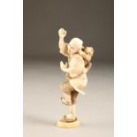 Japanese ivory okimono of a man with monkey on his back, Meiji period. 14cm high (light damage)