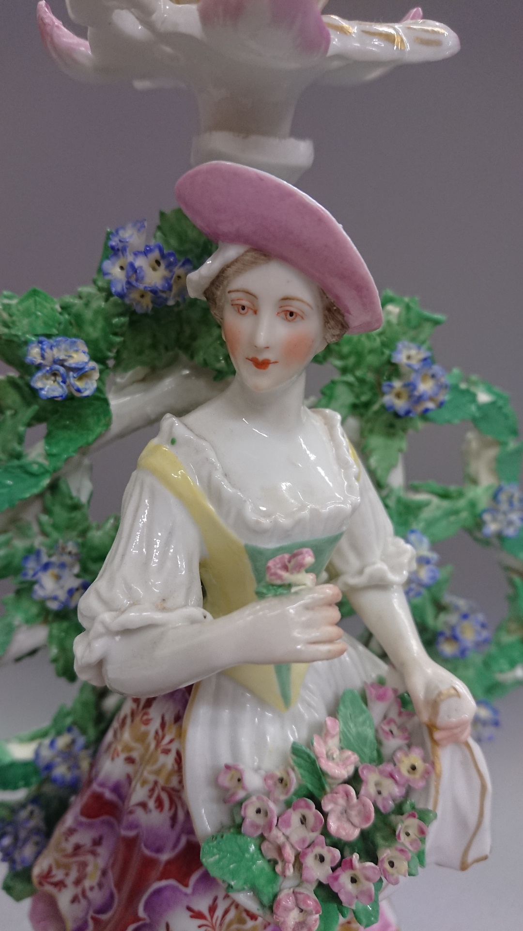 Chelsea Derby porcelain bocage figure candlestick, shepherdess with a lamb raised on a pink and gilt - Image 7 of 9