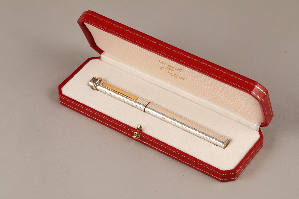 Must de Cartier silver and gilt fountain pen, boxed in a presentation case with guarantee card and