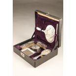 Boxed nine piece Chinese export silver dressing table set which includes, circular trinket dish
