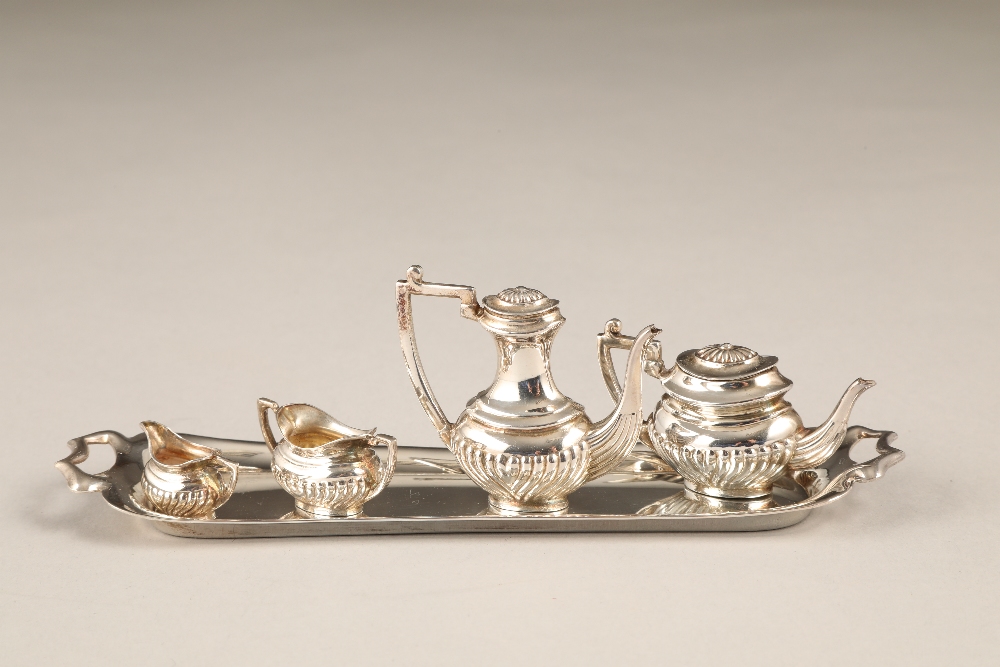 Five piece miniature silver tea and coffee service, including a tray, tea and coffee pot, sugar
