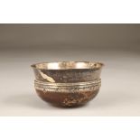 Silver bowl with a turned hardwood base, assay marked Sheffield 1956. 120mm diameter