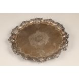 Victorian silver salver with floral border raised on three feet, by Walker & Hall.
