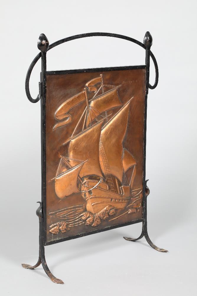 Arts & Crafts fire screen, wrought iron frame with an embossed ship copper panel. 61cm wide, 84cm