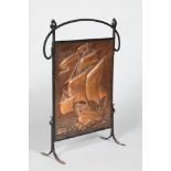 Arts & Crafts fire screen, wrought iron frame with an embossed ship copper panel. 61cm wide, 84cm