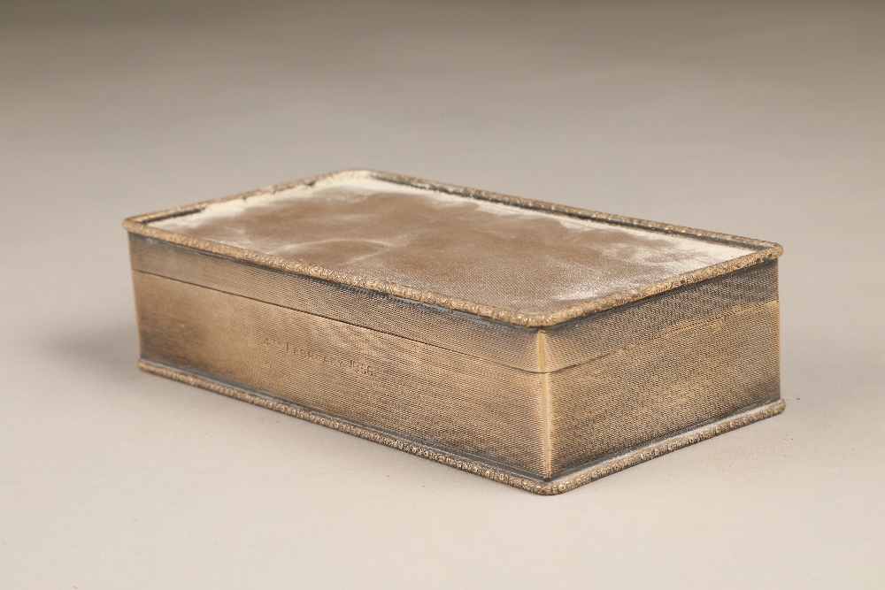 Silver cigarette box, engine turned decoration. Assay marked Birmingham 1953. 172mm long 90mm wide