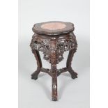 Chinese hardwood jardiniere stand, rouge marble insert, carved and pierced floral apron, supported