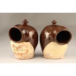 Two Cumnock pottery salt crocks, red brown and cream, one dated 1851. 27cm high