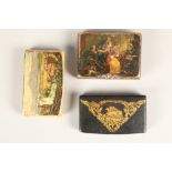 Three assorted wooden snuff boxes; including black snuff box with gilt coursing decoration to cover.