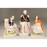 Five assorted Staffordshire pottery figures and a pair of figures with yellow baskets and hats.