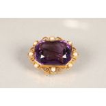 Large 15 carat gold amethyst brooch, emerald cut amethyst set with pearl seeds in a gold mount