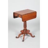 19th century mahogany work table with drop leaves, a single fitted drawer, raised on a turned