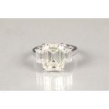 An impressive 6.02 carat emerald cut diamond ring. The diamond measures 11.90 x 9.45 x 6.08mm.