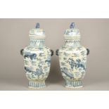 Pair of 20th century Chinese blue and white porcelain vases and covers, decorated with mythical