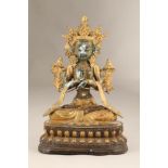 Tibetan bronze figure of a Buddha seated cross legged on throne. Height 47.5cm