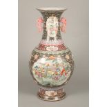20th century Chinese floor vase baluster form, with thin pierced handles, finely decorated panels