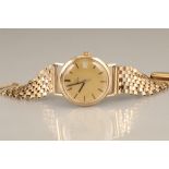 Gents 9 carat gold Omega wrist watch, gilt face with date aperture, gilt baton hour marks, black