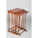 Nest of three mahogany tables, with turned supports and stretchers. Top table measures 52cm long