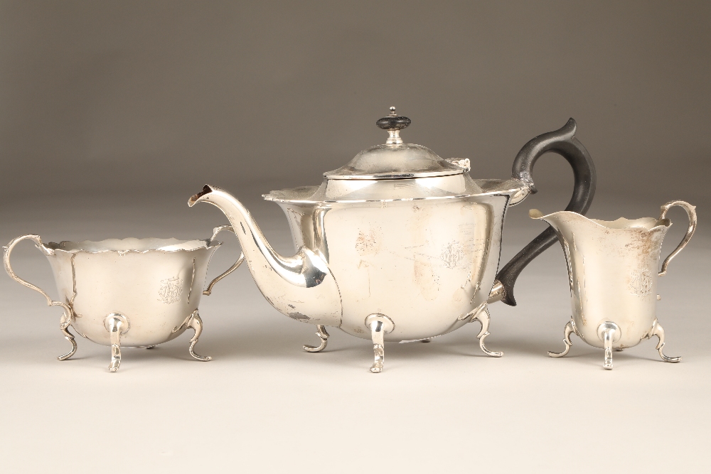 Three piece silver tea service, consisting of teapot, sugar basin and cream jug.