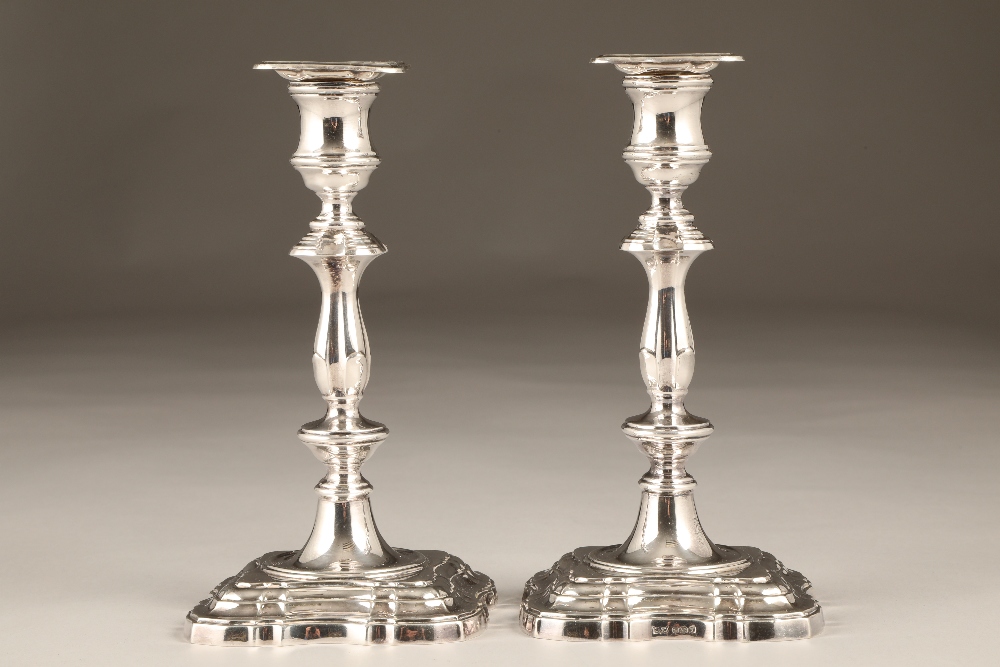 Pair Mappin and Webb silver candlesticks, turned stems and stepped serpentine square bases, assay