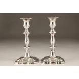 Pair Mappin and Webb silver candlesticks, turned stems and stepped serpentine square bases, assay