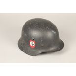 World War II German double decal steel combat helmet, with leather liner with later SS insignia to