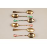 Boxed set of six silver gilt and enamel coffee spoons. Assay marked Birmingham 1952