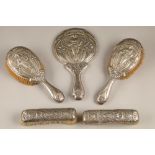 Silver five piece art nouveau dressing table set, consisting of two pairs of brushes and a hand