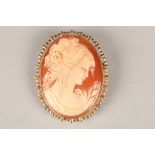 9 carat mounted cameo brooch, oval form, carved classical lady. Total weight 13g. 50mm x 40mm