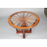 Hardwood cart wheel table, with glass insert top and orignal wrought iron wheel rim. 140cm