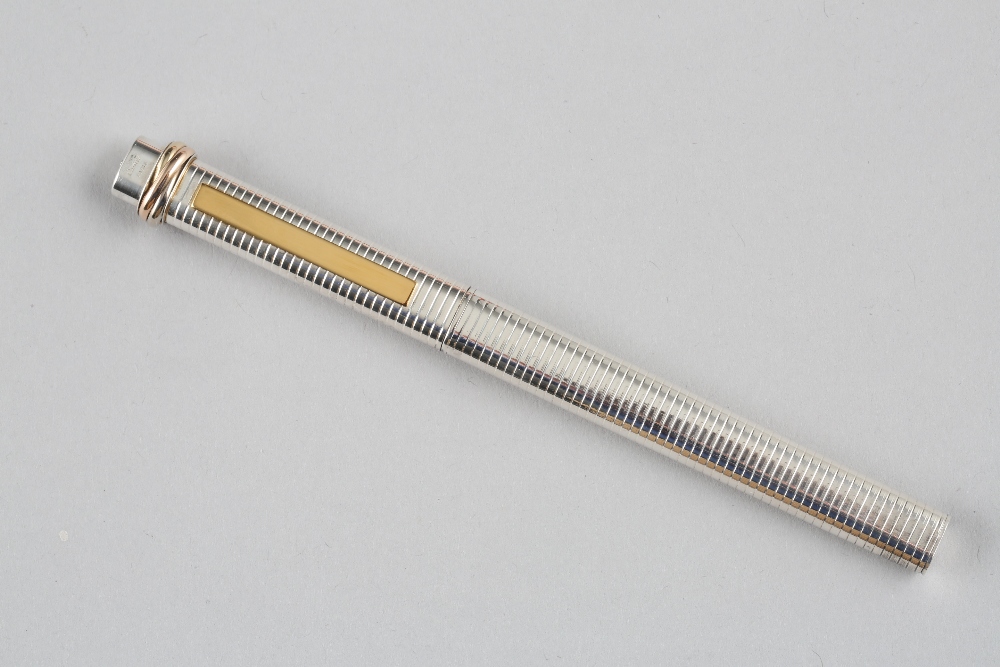 Must de Cartier silver and gilt biro pen, boxed in a presentation case with guarantee card and - Image 2 of 3