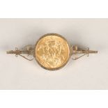 Victorian gold sovereign 1898 in a 9 carat gold bar brooch mount. Total weight 12g