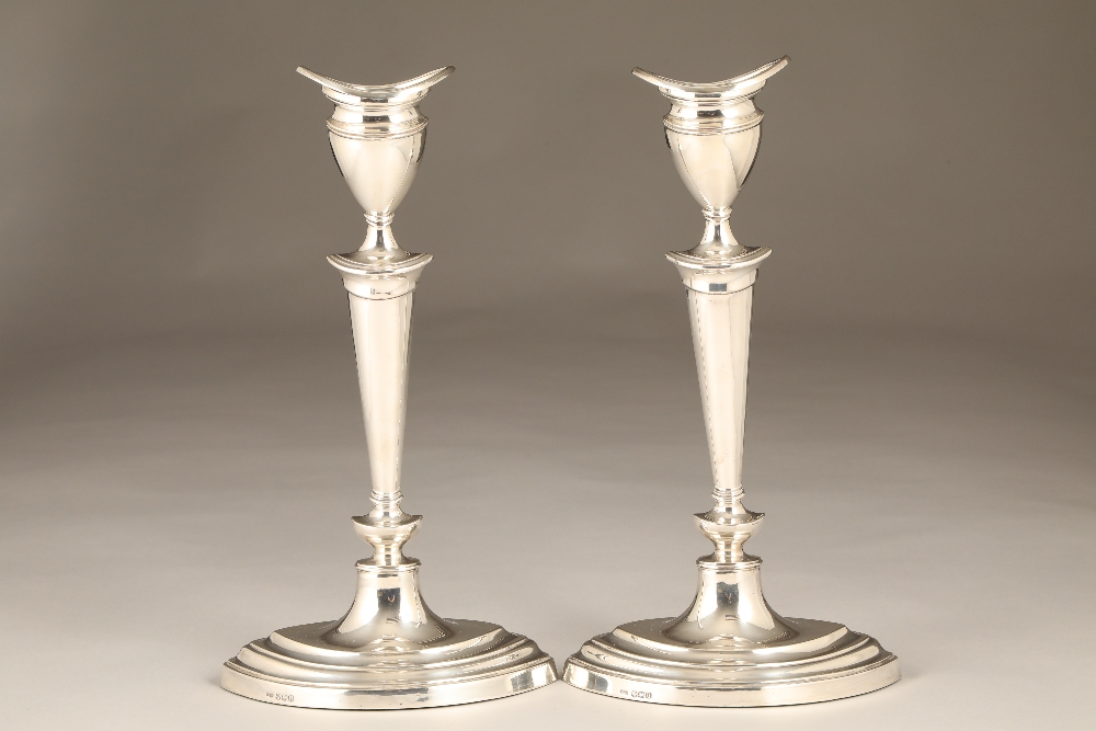 Pair of silver candlesticks, oval form, assay marked Sheffield 1937. 30cm high