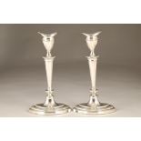 Pair of silver candlesticks, oval form, assay marked Sheffield 1937. 30cm high