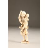 Japanese ivory okimono of a farmer with a young child on his shoulders, Meiji period. 14cm high (