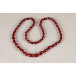 Cherry amber necklace, approx 70cm long. Largest bead 17mm long, weight 33g