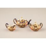 A miniature Royal Crown Derby three piece tea service, in the imari pattern