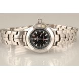 Ladies Tag Heuer Tiger Woods limited edition wrist watch. Stainless steel strap, black dimpled