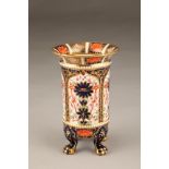 Royal Crown Derby vase of cylindrical form, raised on four paw feet, imari pattern. 17cm high