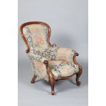 Victorian mahogany framed his and hers parlour chairs, blue and gold floral upholstery. On scroll