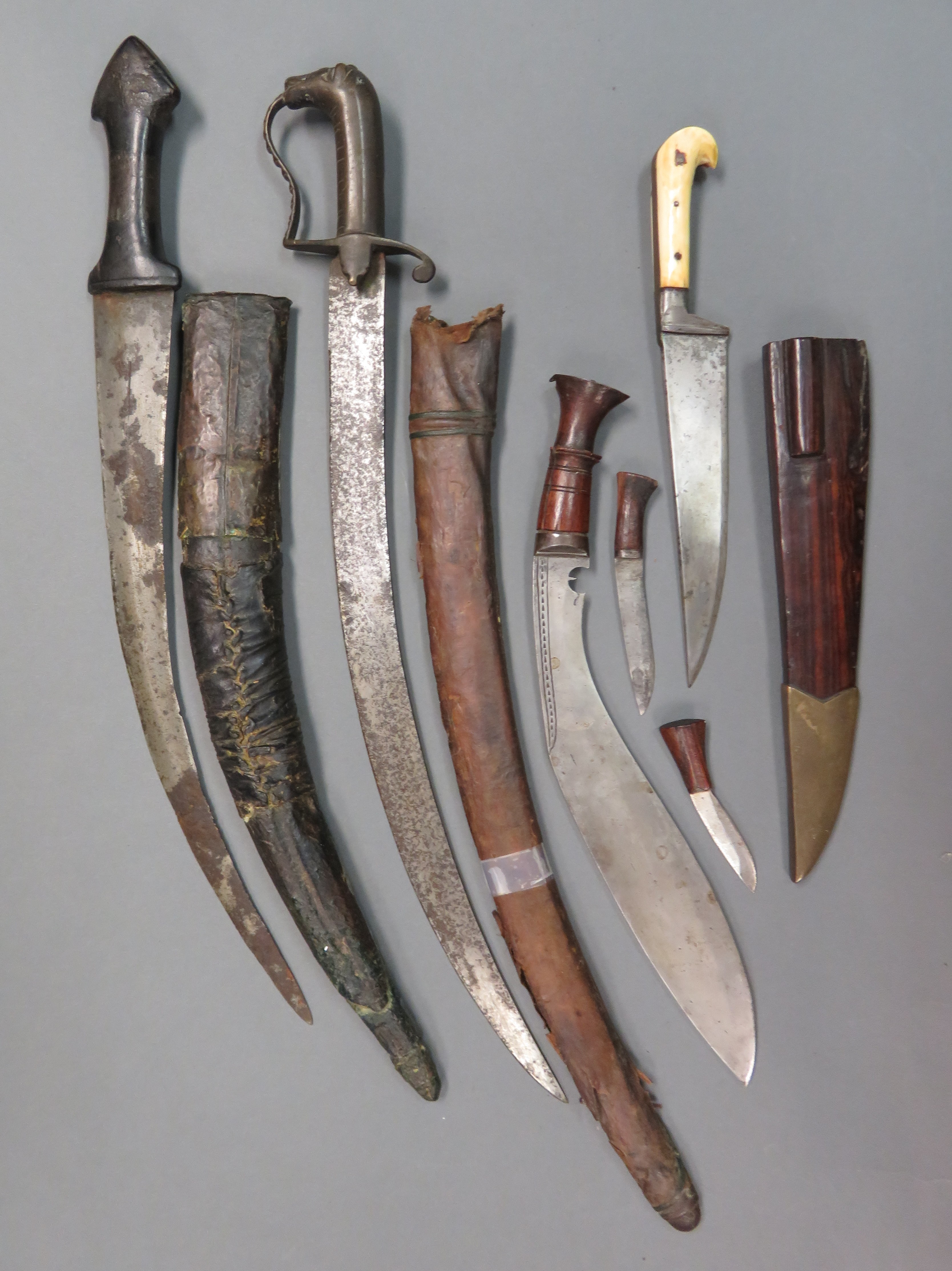 ˜AN INDIAN DAGGER (KARD) AND THREE FURTHER DAGGERS, 19TH AND 20TH CENTURY